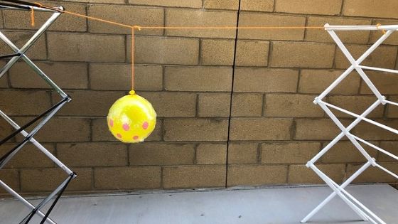 Yarn Pumpkin Hanging Between Racks