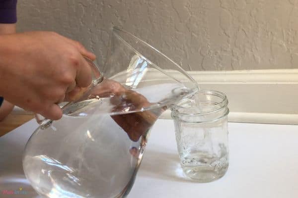 Disappearing Coin Trick Pouring Water in Glass