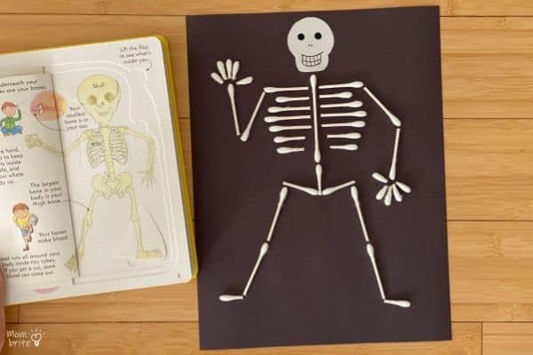 Day of the Dead Crafts and Activities for Kids featured by top Seattle lifestyle blogger, Marcie in Mommyland: QTip Skeleton with Book