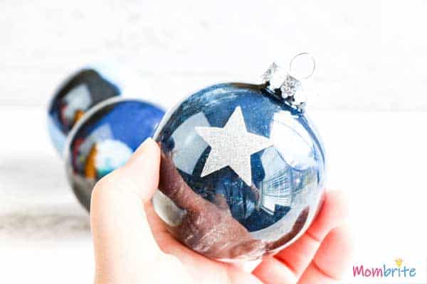 Add stickers if desired on Galaxy Painted Clear Ornament
