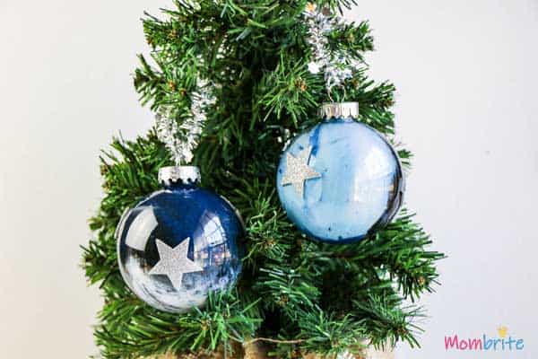50+ Easy DIY Christmas Ornament Crafts for Kids Galaxy Painted Ornament decorated on christmax tree