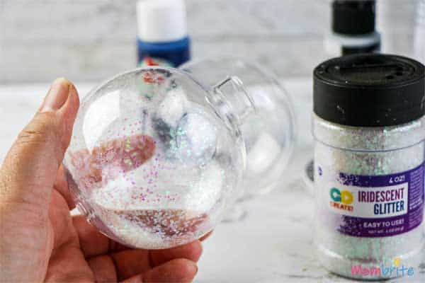 Iridescent glitter aplied on clear plastic ornament balls