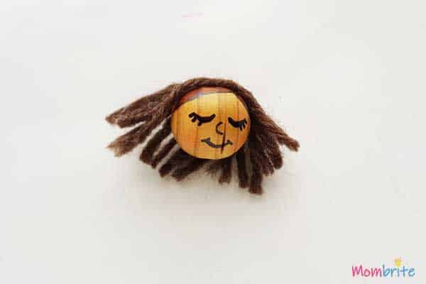 Pinecone Angel face draw on wooden bead