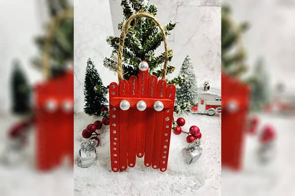 Red coloured Popsicle Sticks Christmas tree craft