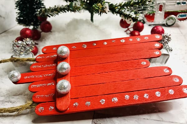 Easy DIY Popsicle Stick Sled Ornament Craft | Mombrite