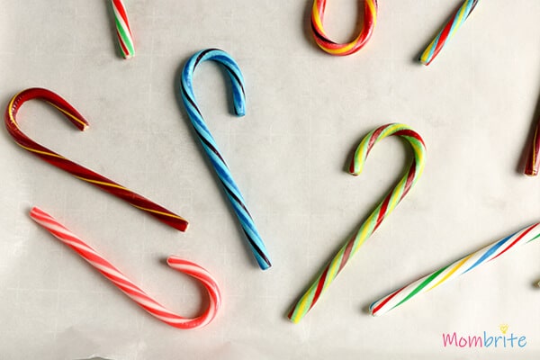 Unwrap and place the candy canes on the baking sheet