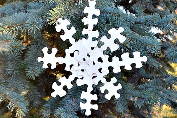 Hand made puzzles piece snowflake ornament 