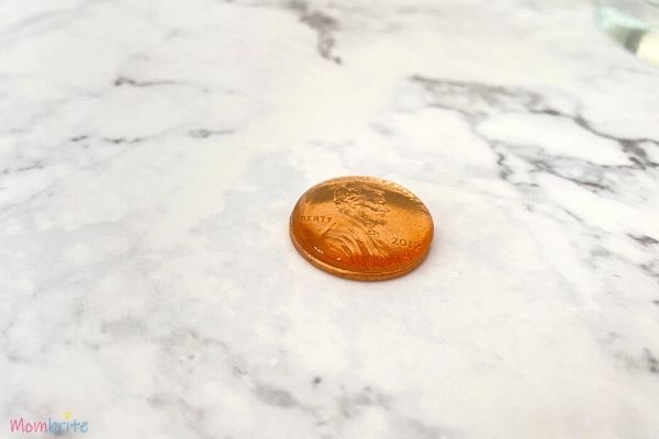 Drops of Water on Penny Surface Tension