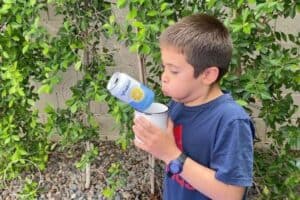 Jumping Beverage Can Blow Between Gap