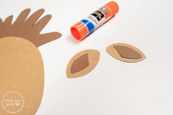 Handprint Reindeer Craft Glue Inner Ears to Outer Ears