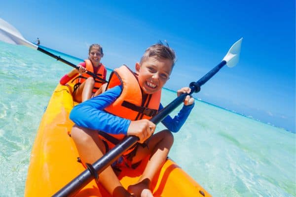 Kids kayaking summer activity