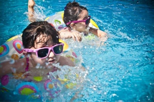 Going swimming or to a splash pad is one of the best fun summer activities for kids