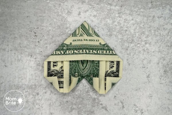 How to Make a Dollar Bill Origami Heart (Easy Money Folding Tutorial) Dollar Bill Heart - Fold the corners in toward the crease line right side