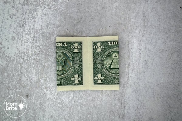 How to Make a Dollar Bill Origami Heart (Easy Money Folding Tutorial) Origami Heart Dollar - Fold left side toward center line