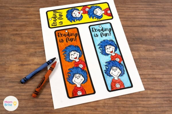 Thing 1 and Thing 2 bookmarks colored with crayons in yellow, orange, and blue