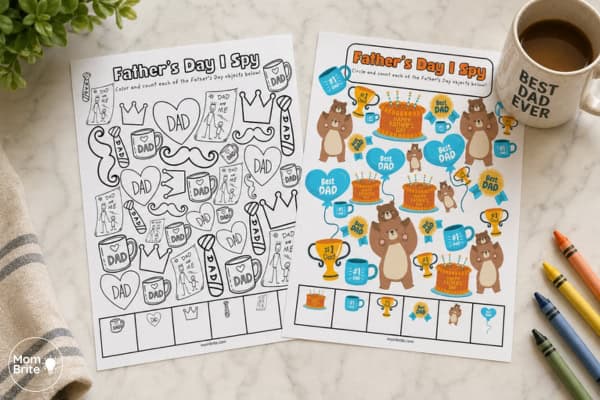 Father’s Day I Spy worksheets on a kitchen countertop with a coffee mug and crayons, including a printable coloring page and a colorful counting game for kids